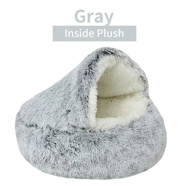 Gray plush pet bed with white interior on a white background