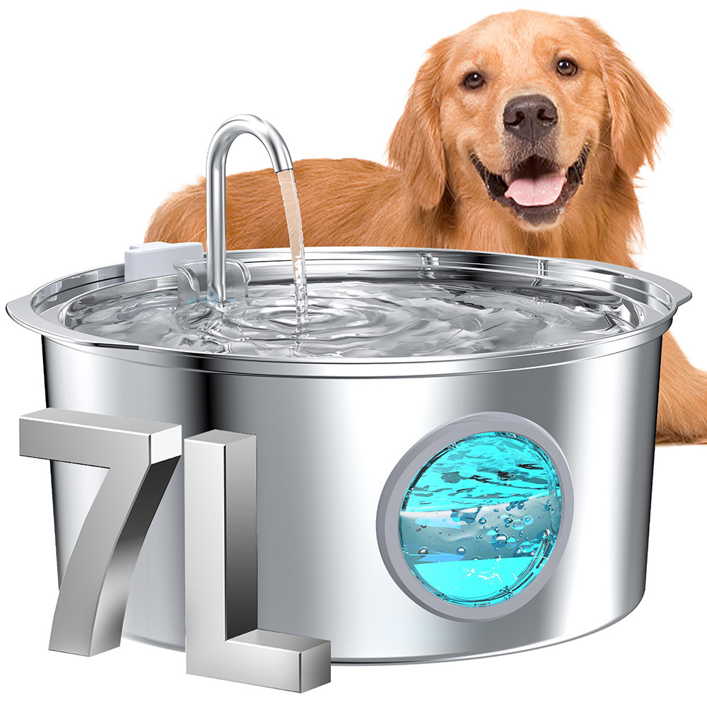 Dog next to a large metallic pet water fountain with water flowing.