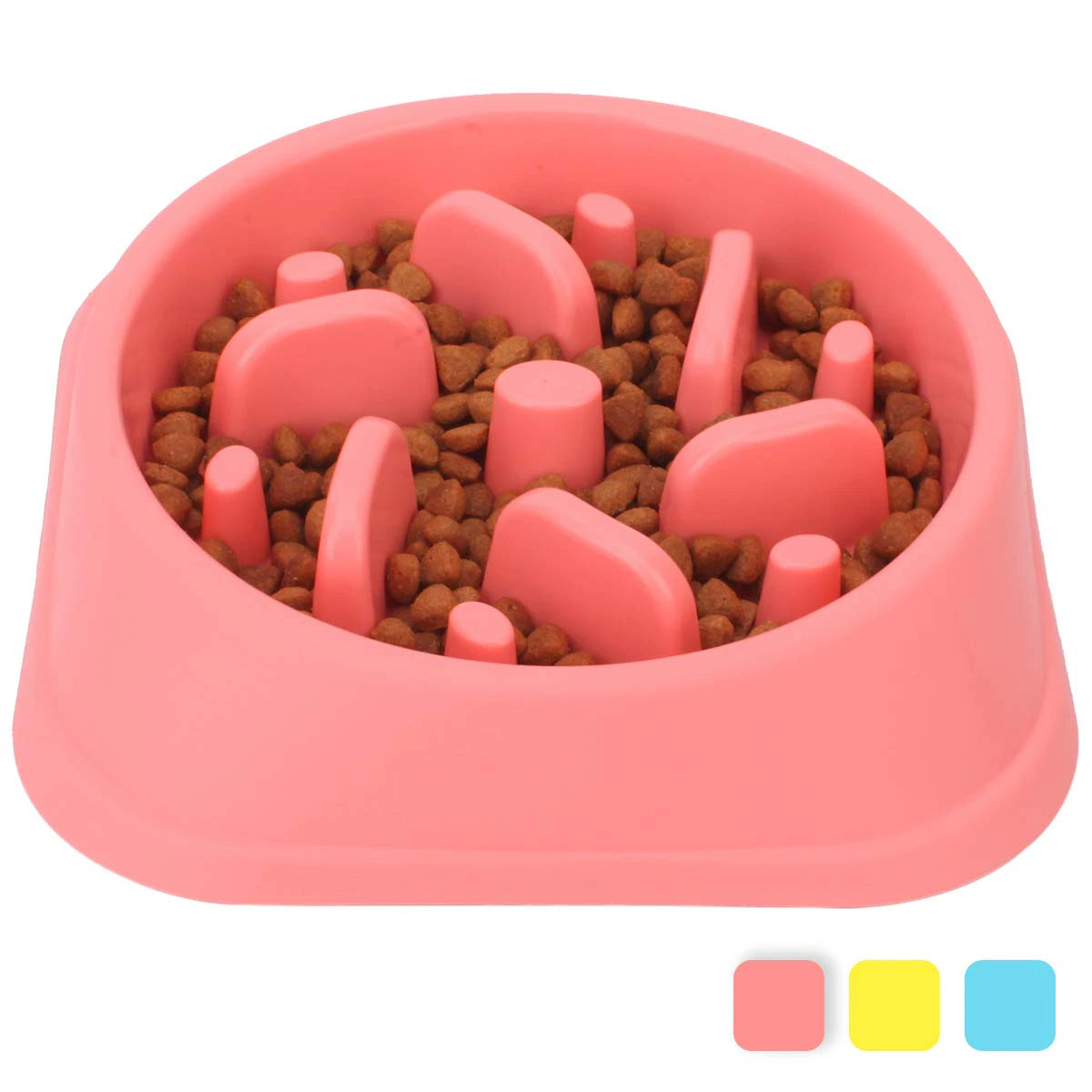 Pink dog food bowl with raised sections filled with kibble on a white background