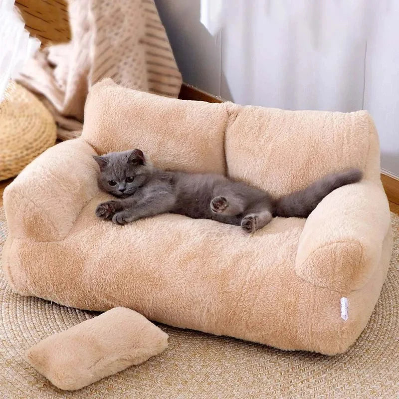 Cat lying on a plush beige pet bed in a cozy room.