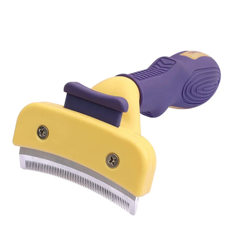 Yellow and purple pet grooming brush on a white background