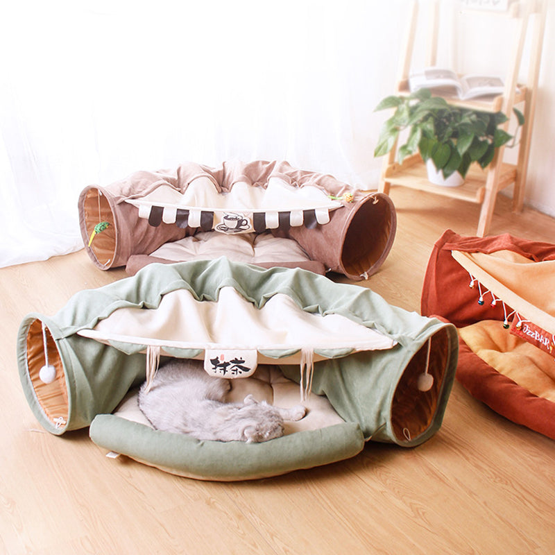 Pet play tunnel with a cat inside on a wooden floor