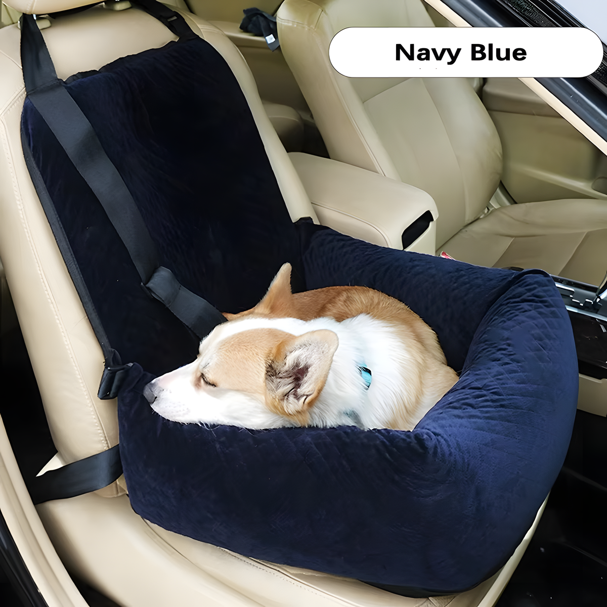 A navy blue pet car seat booster with built-in seat belts, shown on a beige car seat with a sleeping corgi dog inside. A white label at the top right reads 'Navy Blue'.