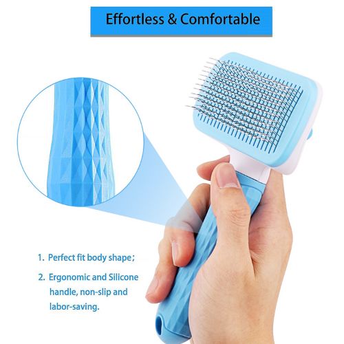 Blue pet grooming brush held by a hand with ergonomic design and silicone handle.