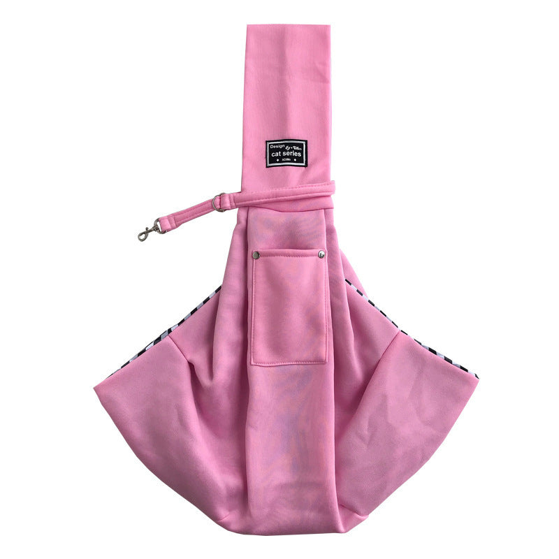 Pink dog sling with a brand label on a white background