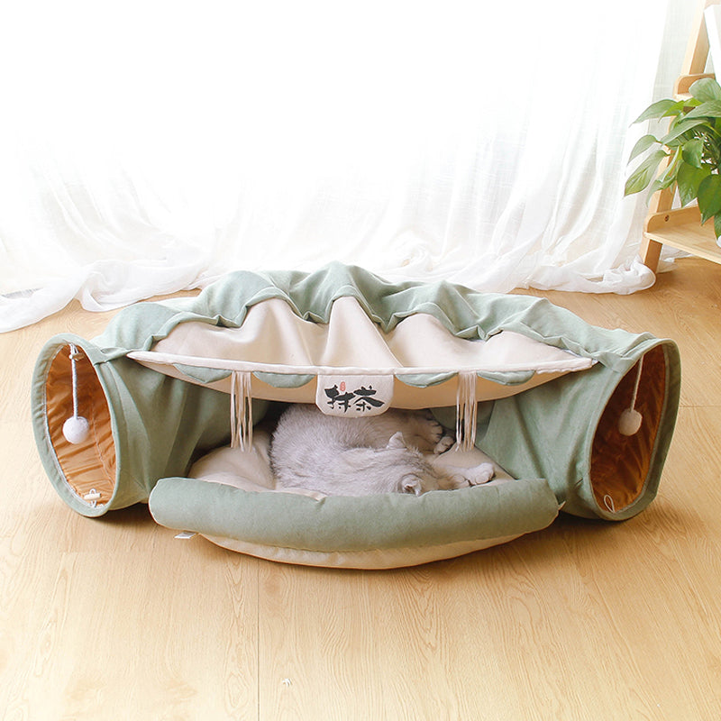 Pet playpen with a cat inside on a wooden floor