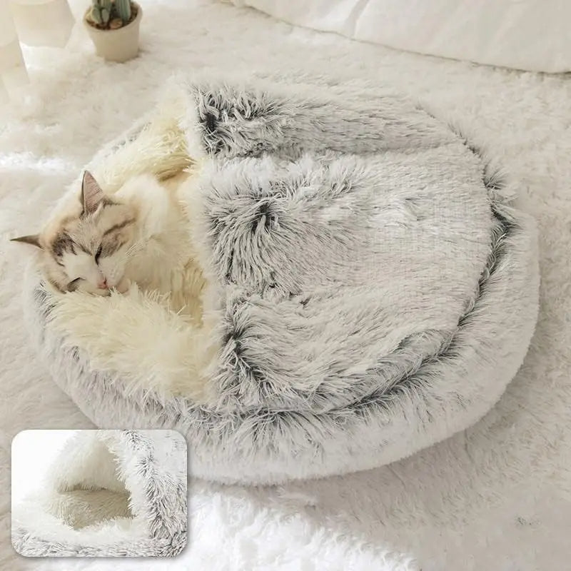 Cat sleeping in a fluffy white pet bed on a soft surface