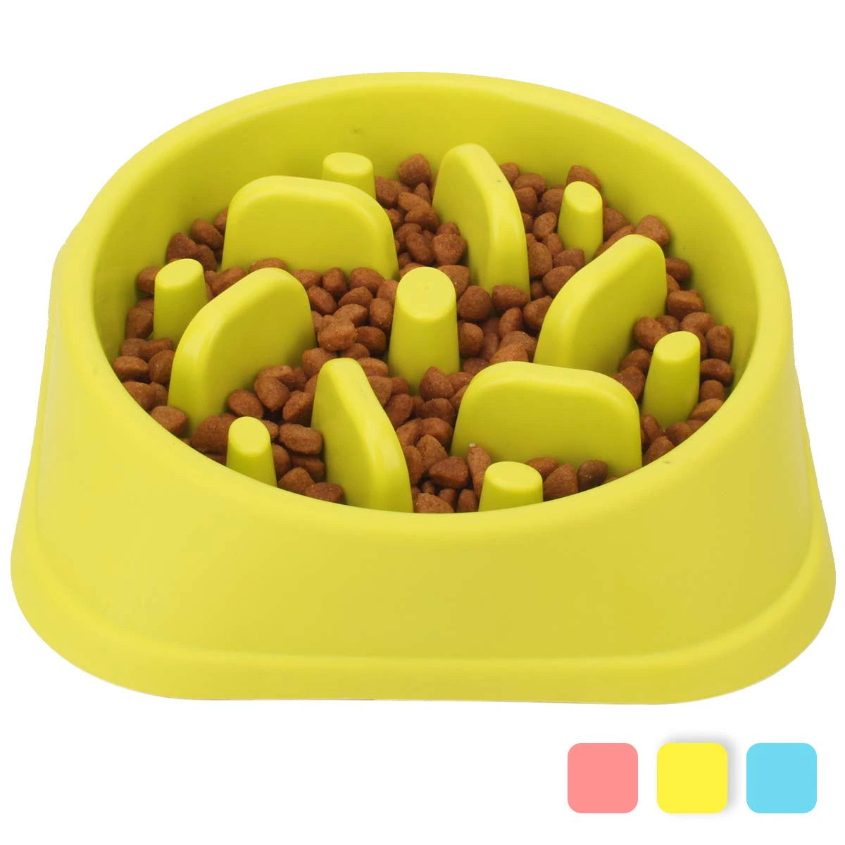 Yellow dog food bowl with raised sections filled with kibble on a white background