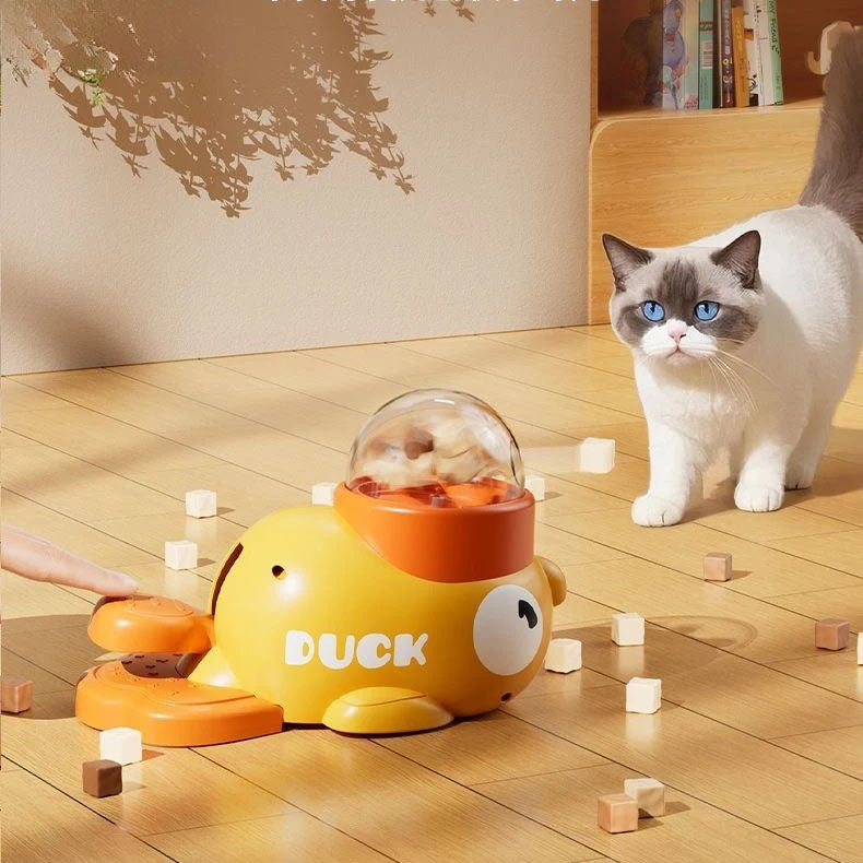 Cat playing with a duck-shaped toy on a wooden floor